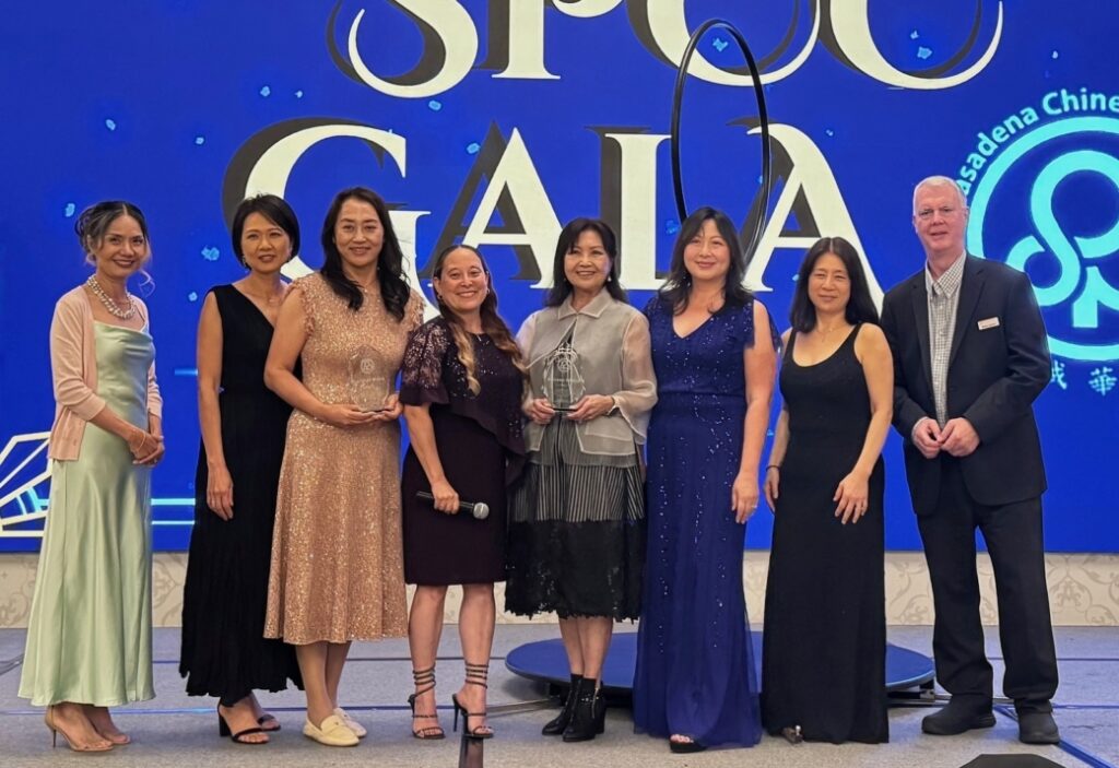 Image of HSA winners Carolyn Hah (3rd from left) and Shireen Chang (5th from left) with SPCC board members