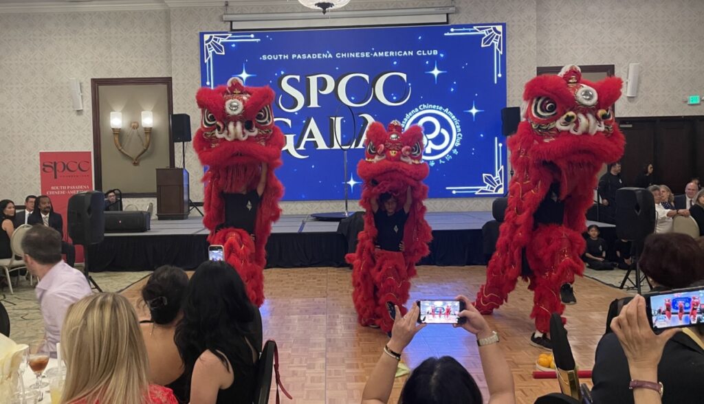 Image of Kong’s Siu Lum Pai Kung Fu Association from Monterey Park performing the Lion Dance throughout the venue. 